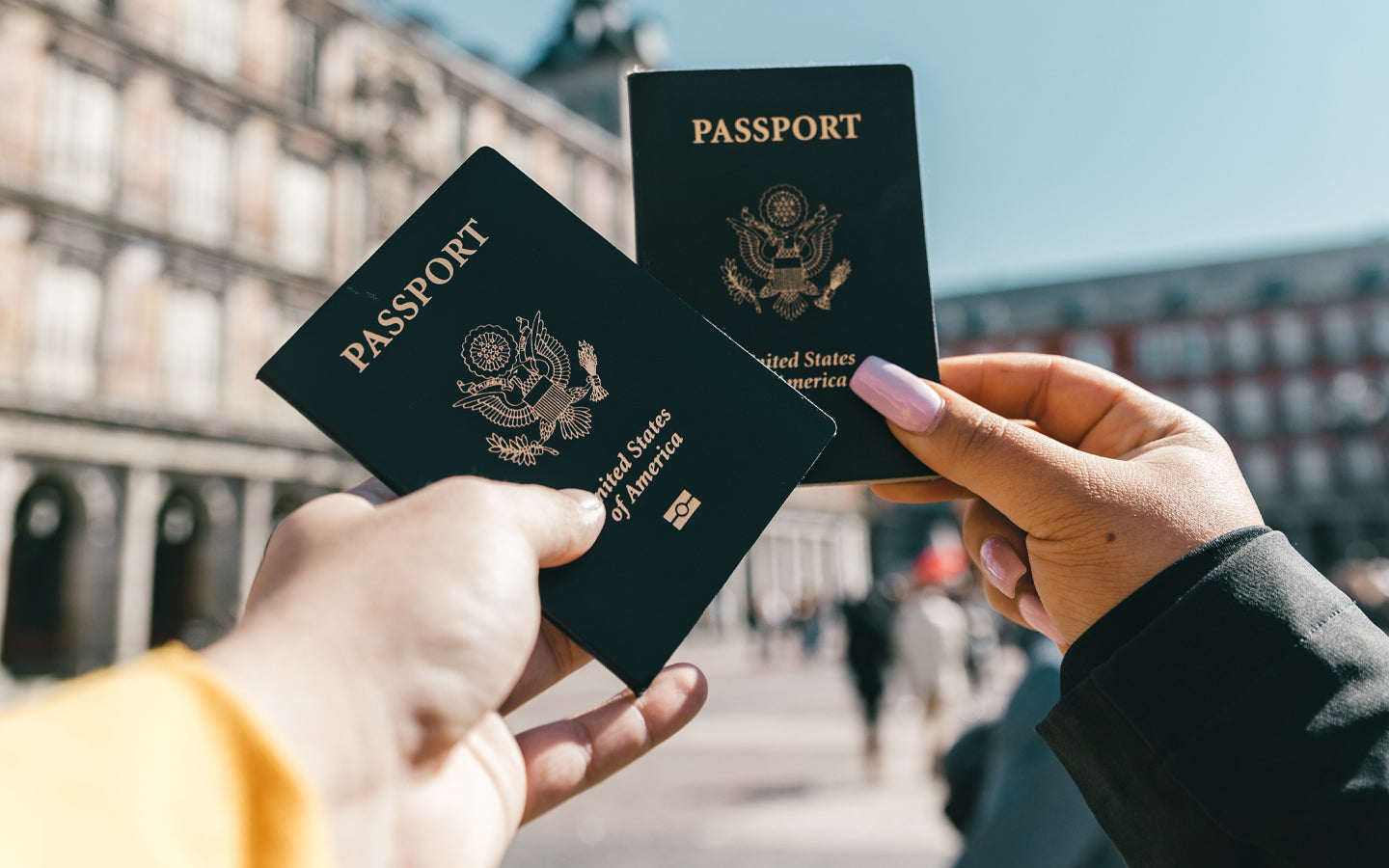 2 American passports being held up