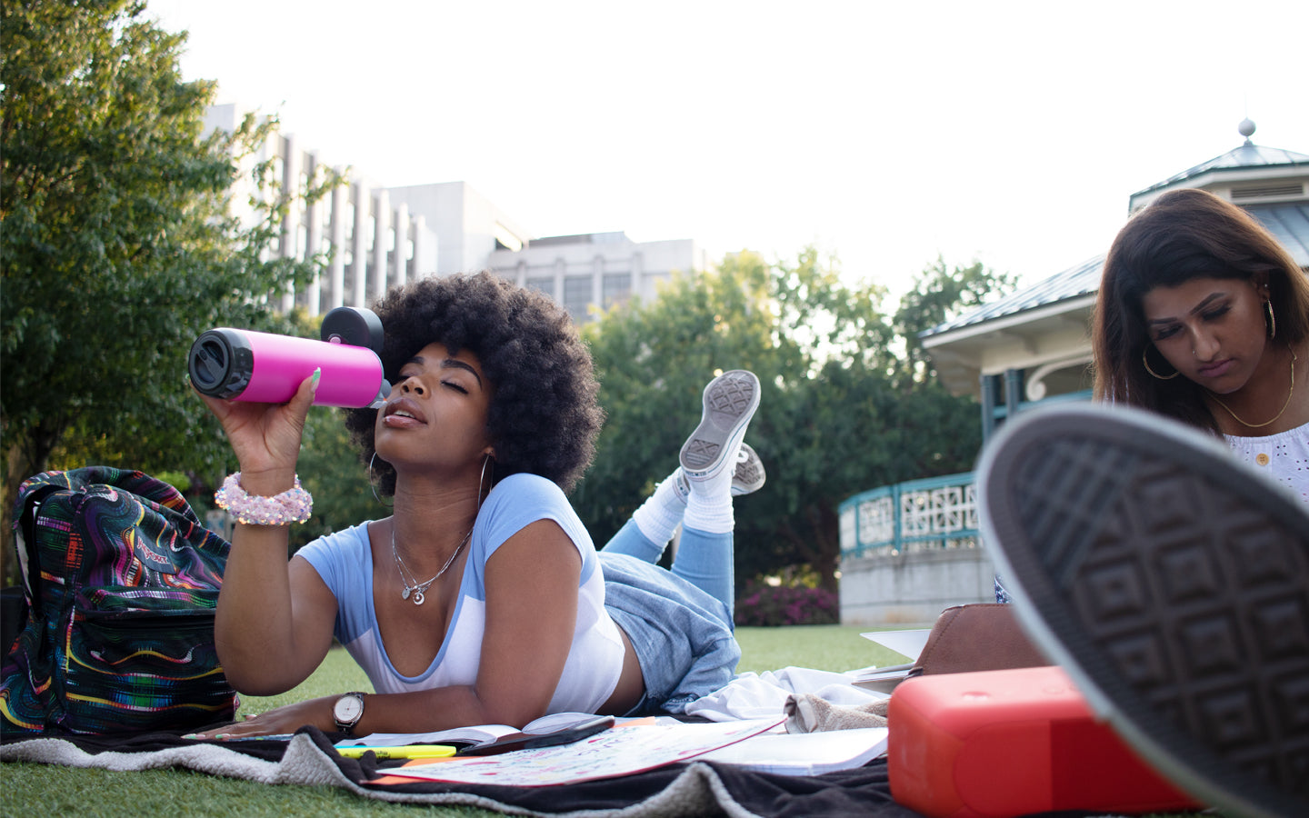 women walking dog outside in a forest of snow