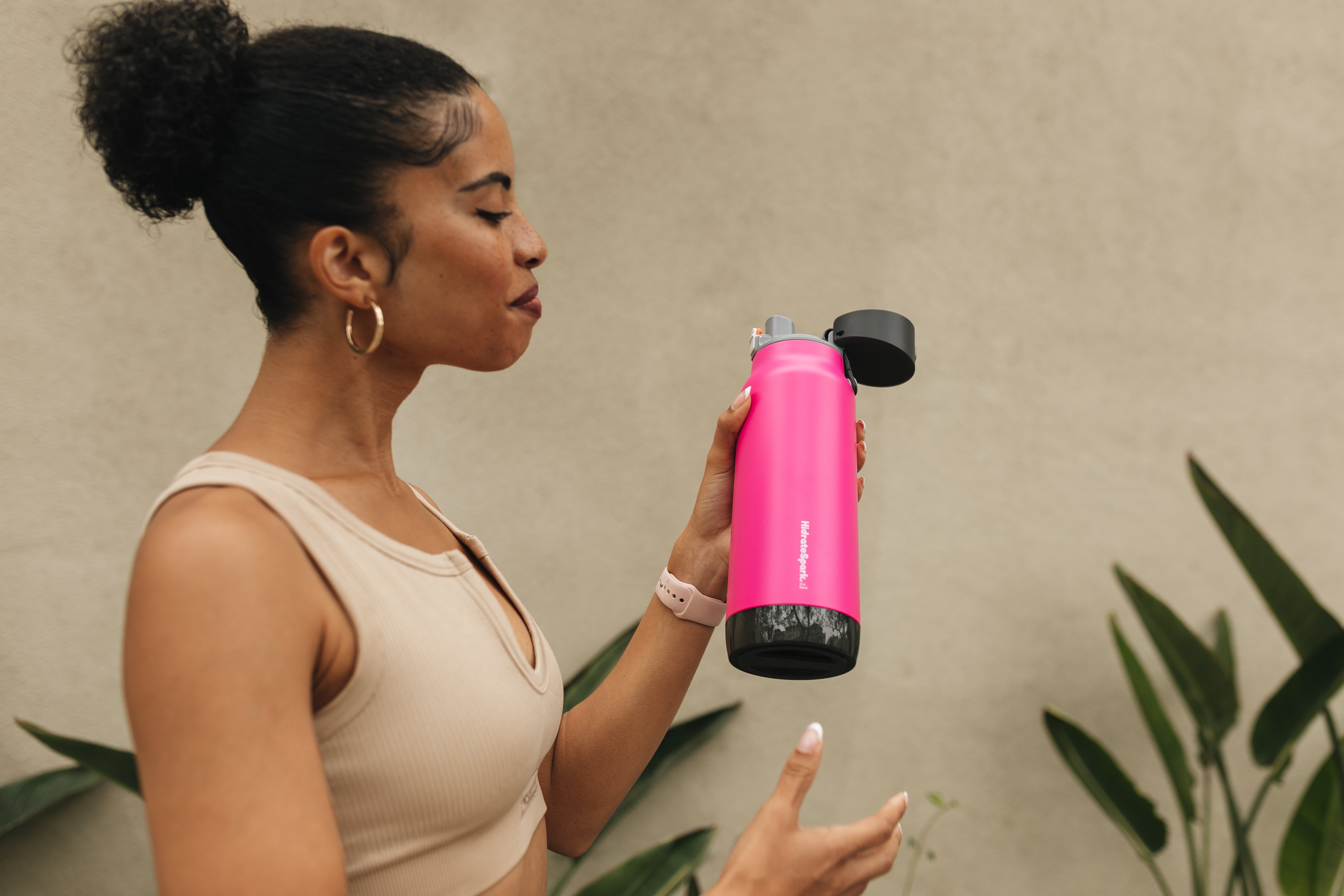A woman hydrating for younger skin.