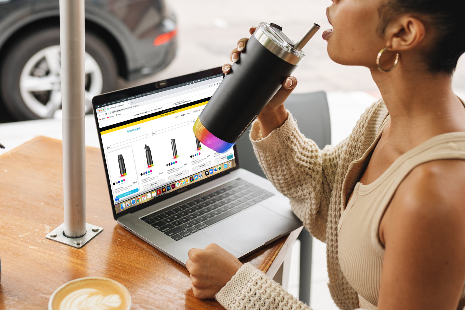 A woman sipping and reviewing HidrateSpark options to quell a dehydration headache.