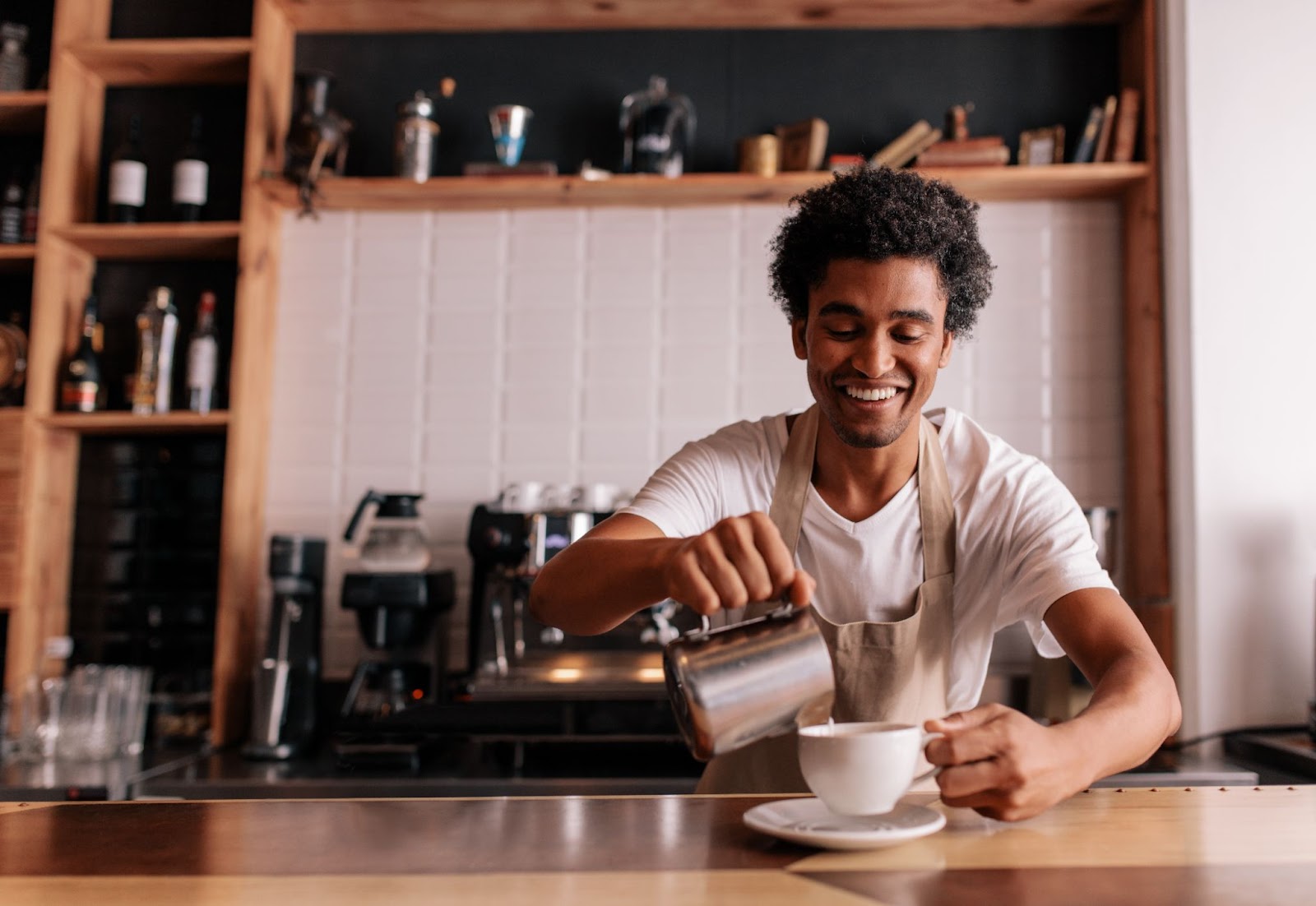 A person brewing coffee to answer the question: Is coffee hydrating?